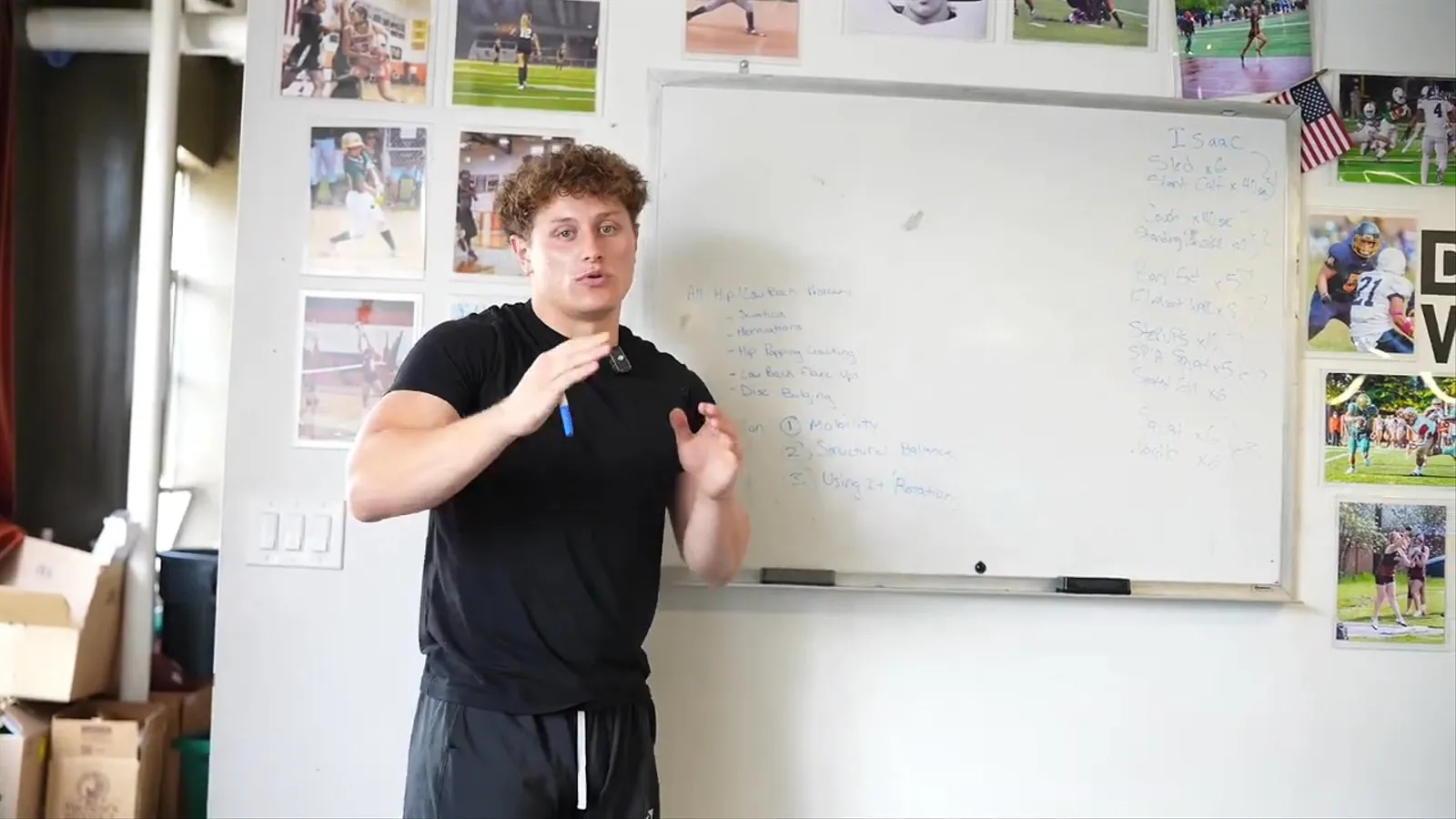 Justin Mucci explaining hip and low back pain at a whiteboard